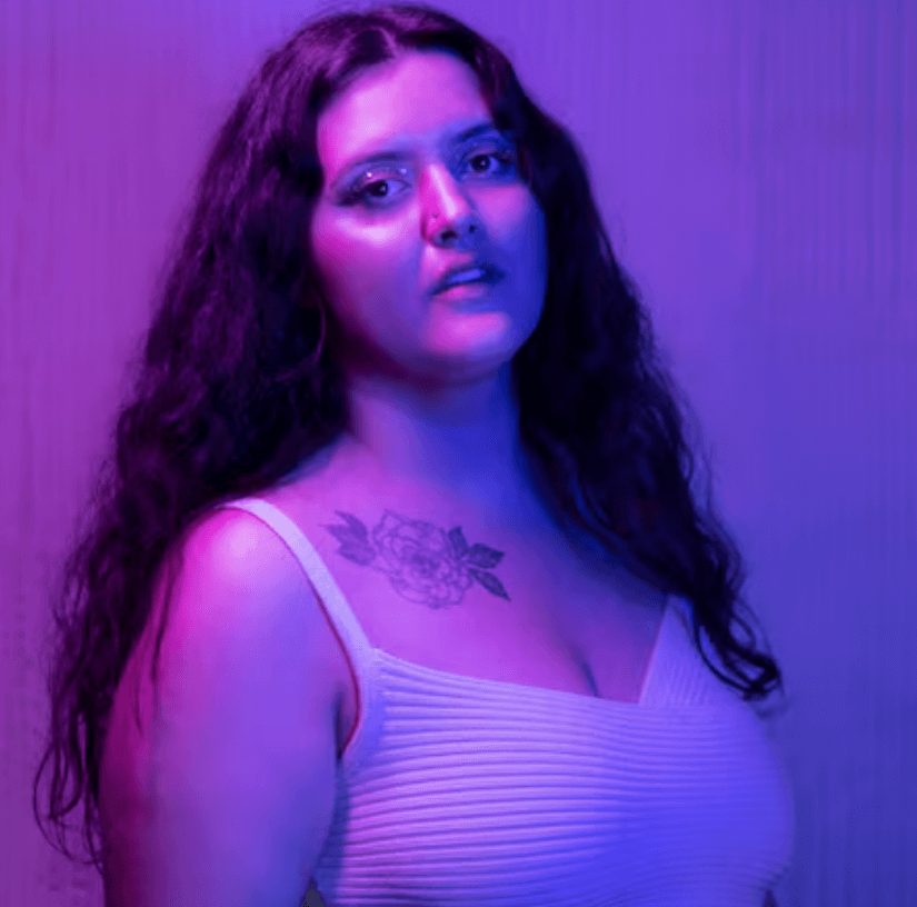 Curvy Indian woman enjoying a café moment